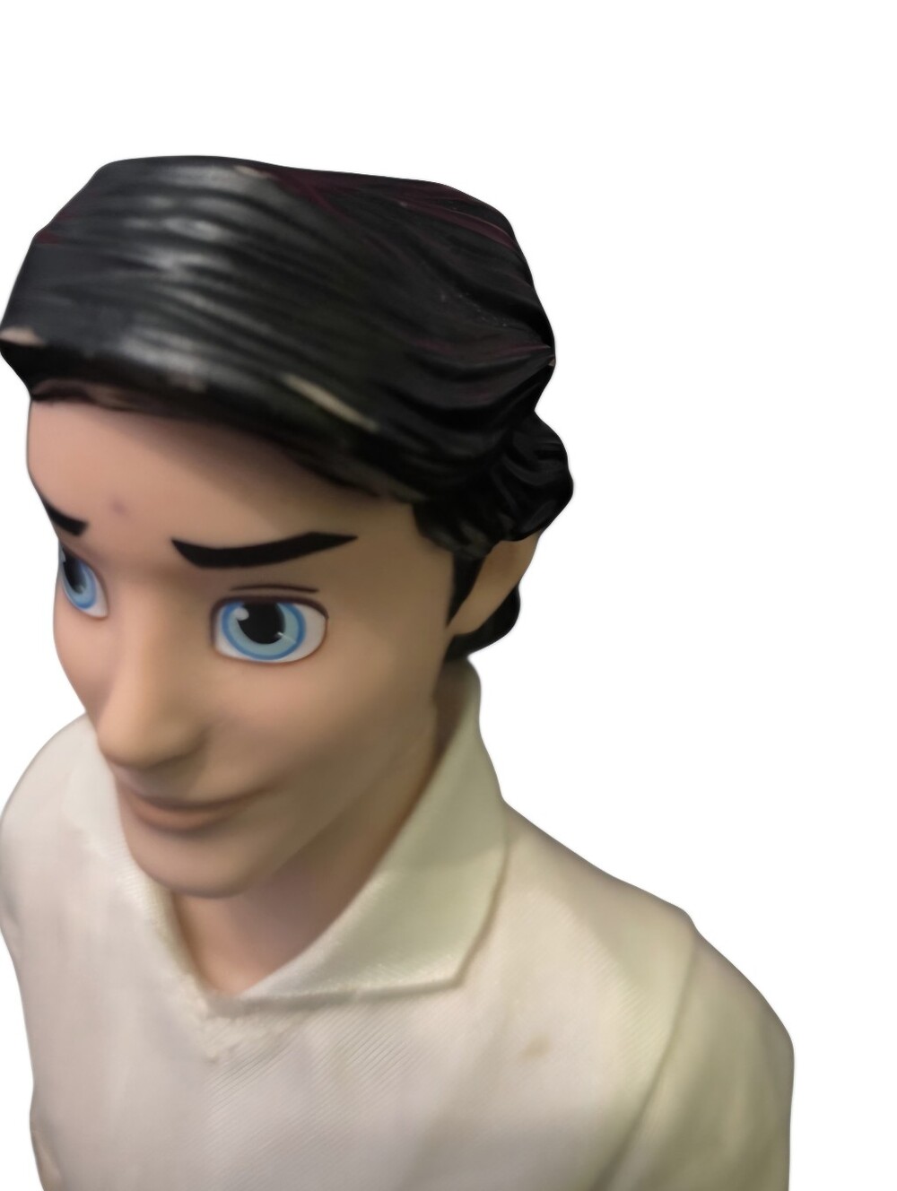 Blue-Eyed Male Doll Figure with Black Hair and White Shirt